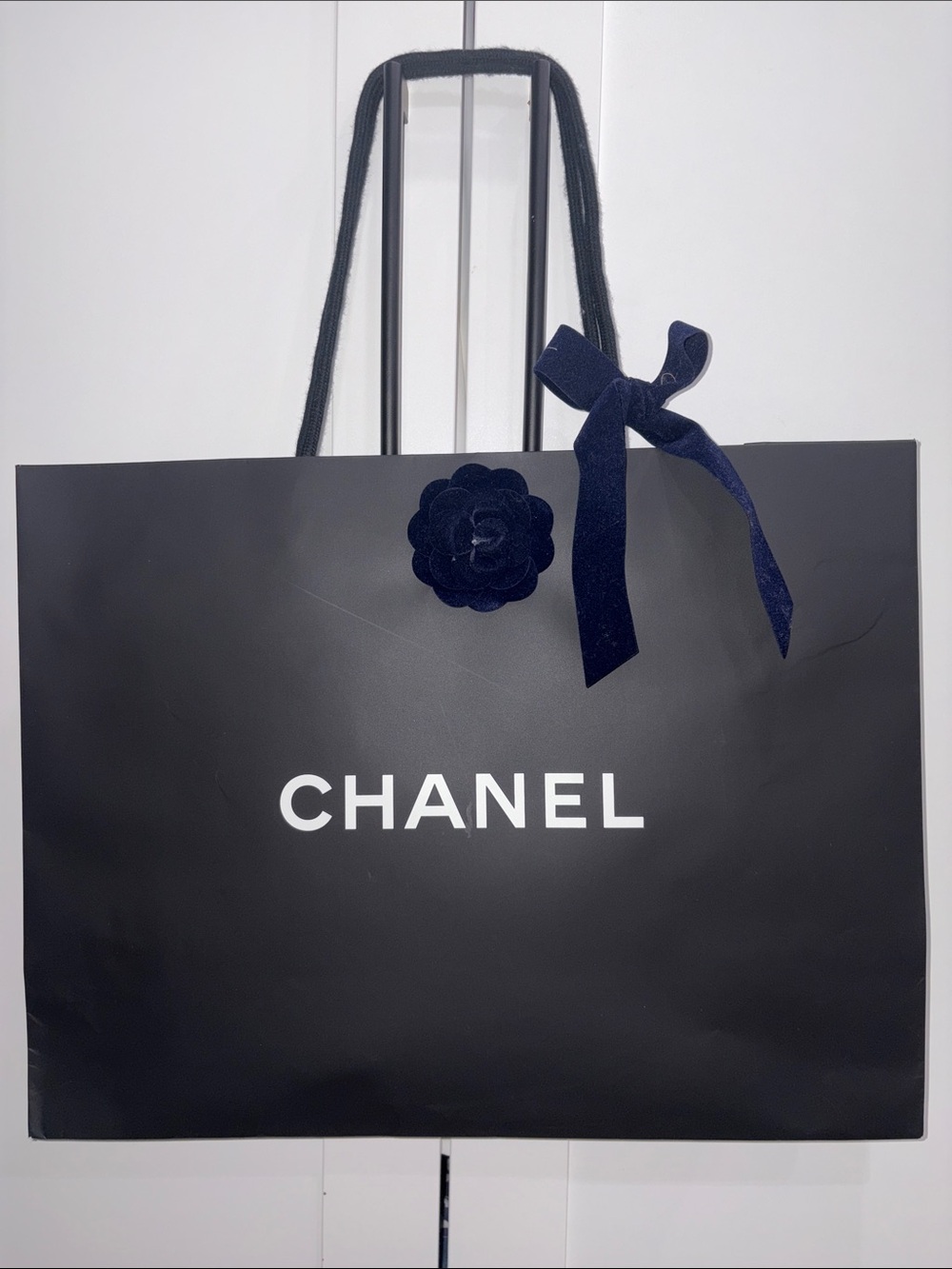 CHANEL Black Shopping Bag with Dark Navy Ribbon and Camellia